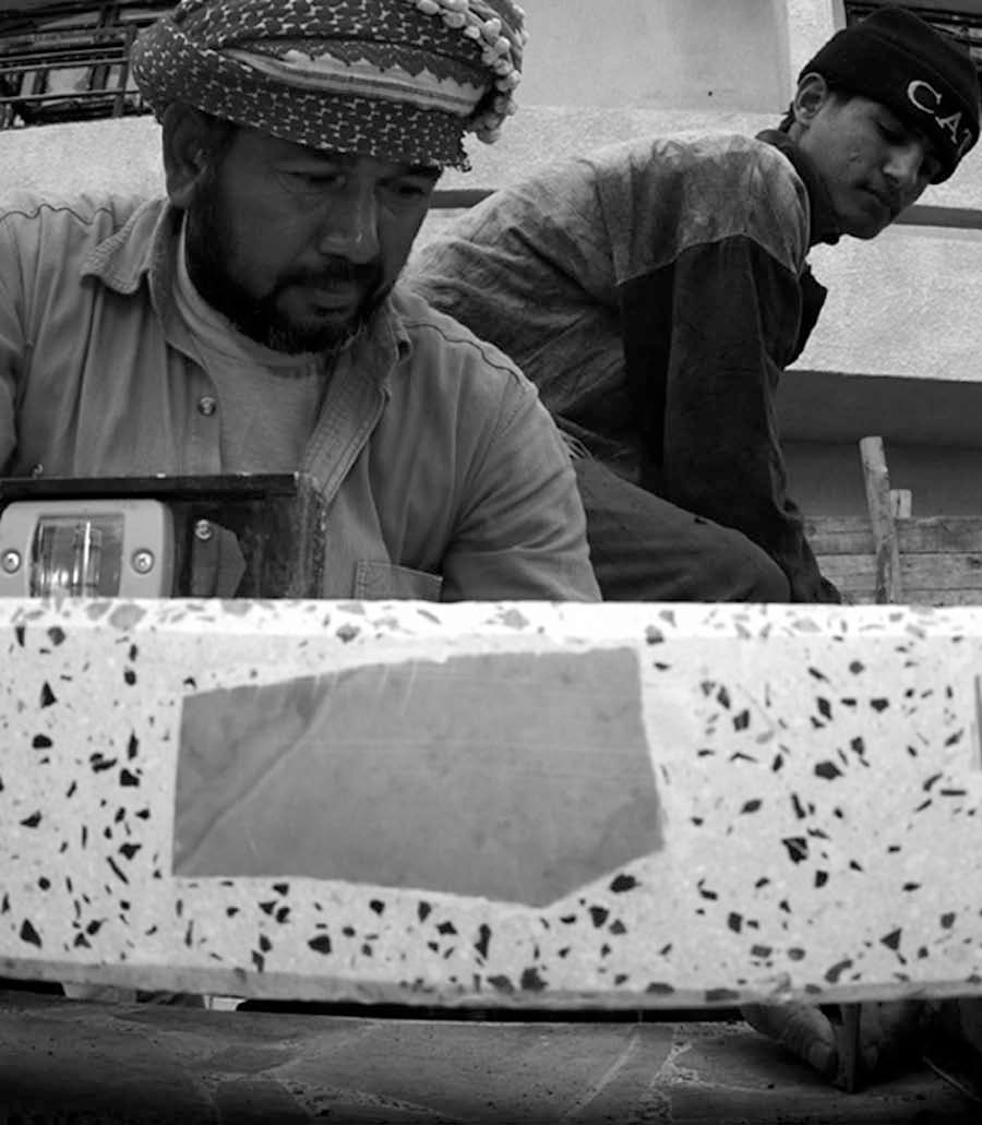 Iraqi workers hired to build steps beside the Research Triangle Institute Center in Dhi Qar Province, An Nasiri-yah, Iraq, 10 January 2004.